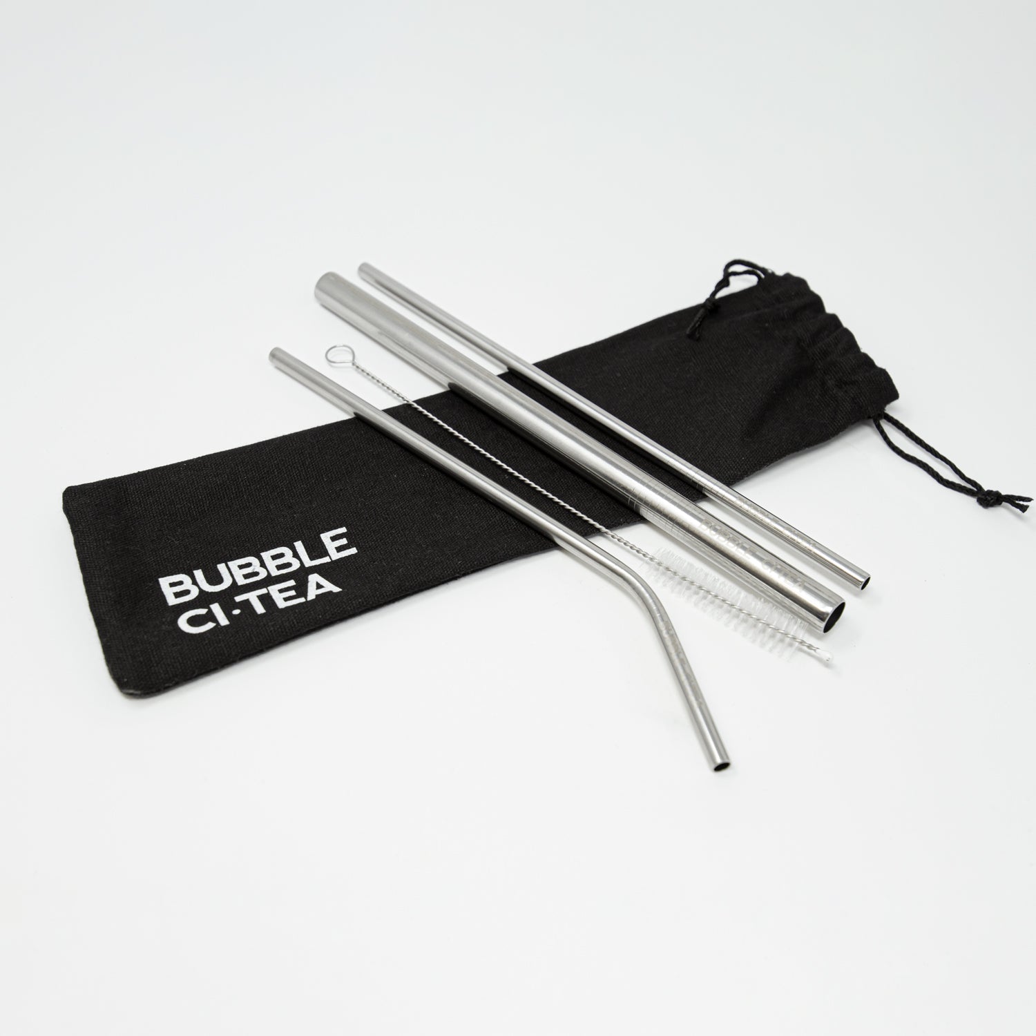 Picture of a pack of stainless steel straws over a black cotton bag with bubble citea logo.  